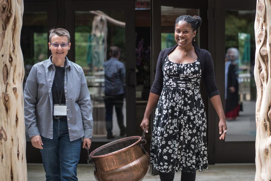 Michelle and Shakiyla assist with an event