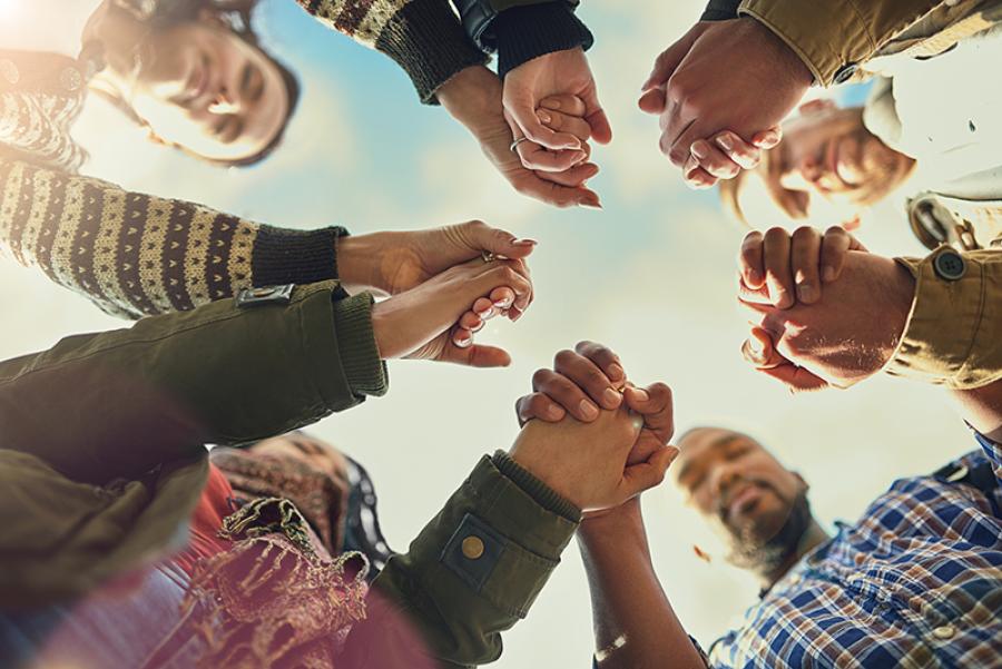 Circle of people holding hands