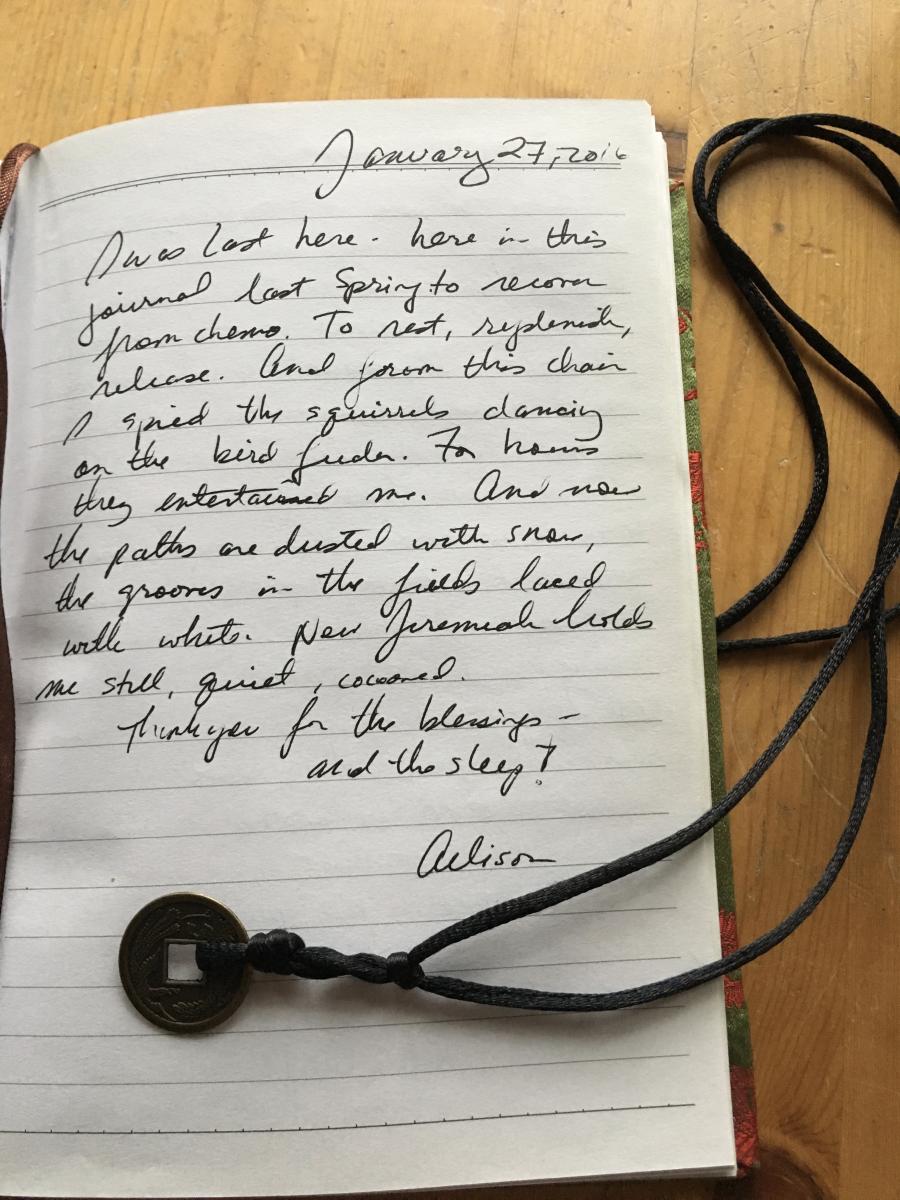 hand written letter from allison with necklace over the paper