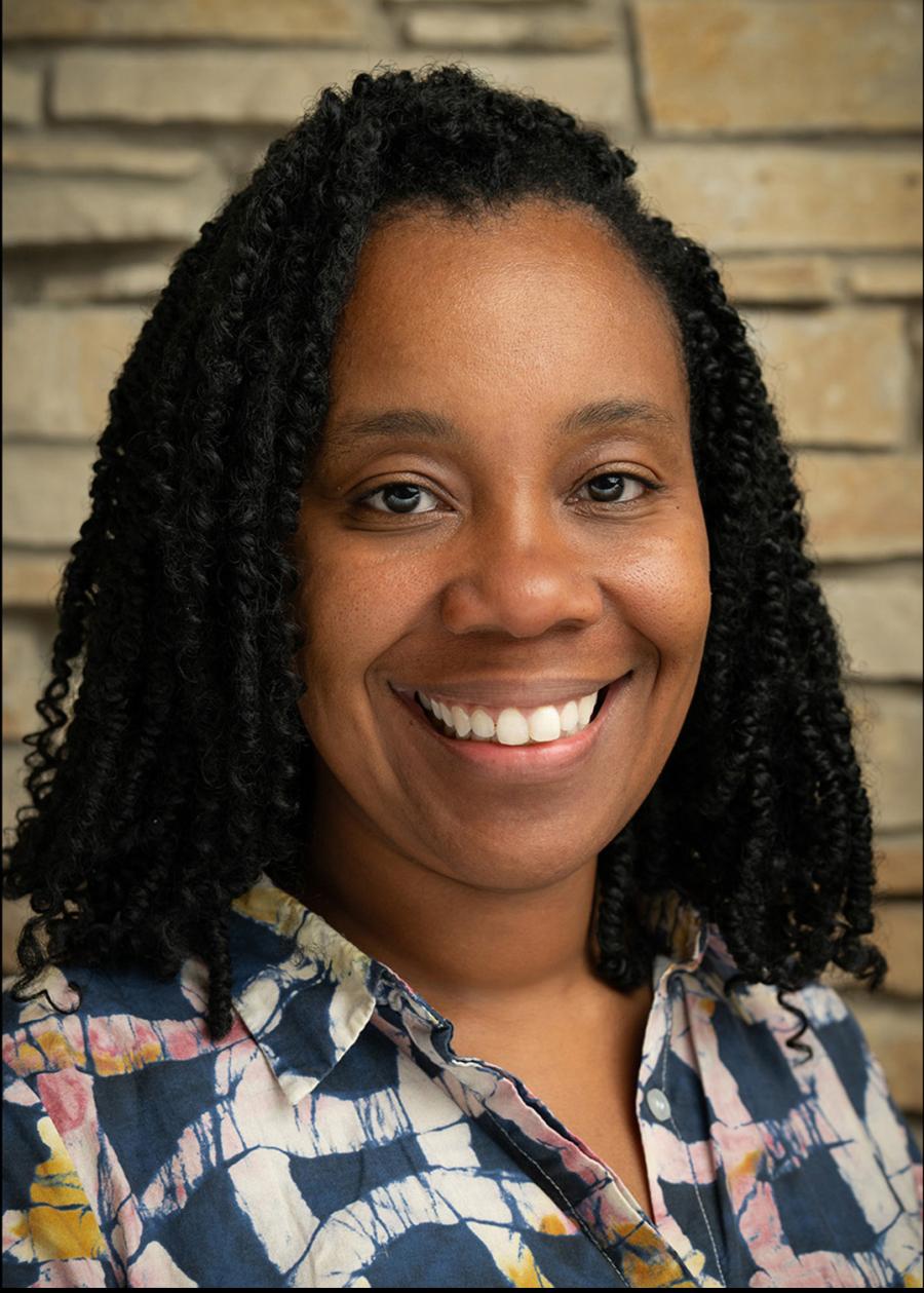 A black woman with shoulder length hair