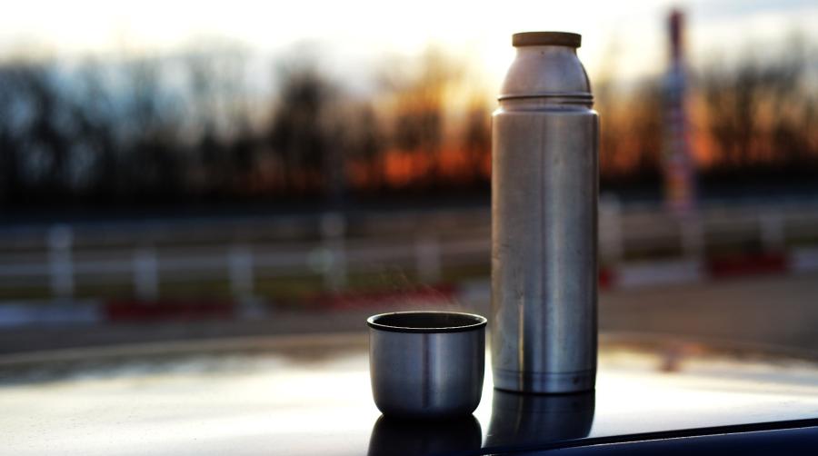 Thermos on outside table at dawn