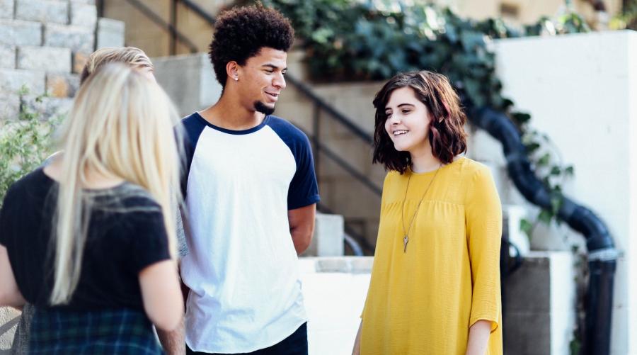 Three young people in conversation