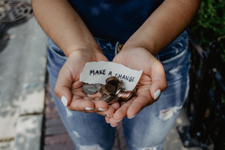 Hands holding loose change