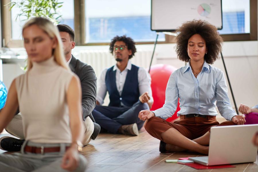 People meditating at work