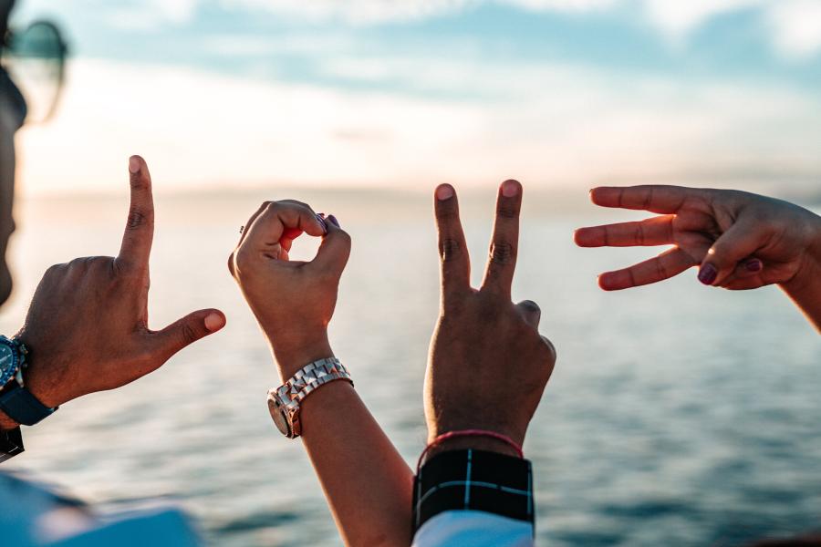 The word love made by two people's hands